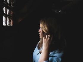 Woman in prison cell