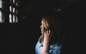 Woman in prison cell