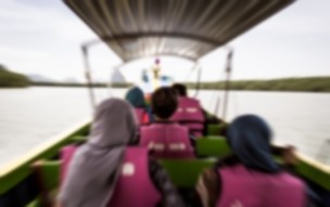 Blurred refugees on a boat