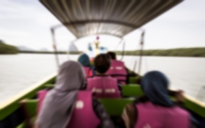 Blurred refugees on a boat